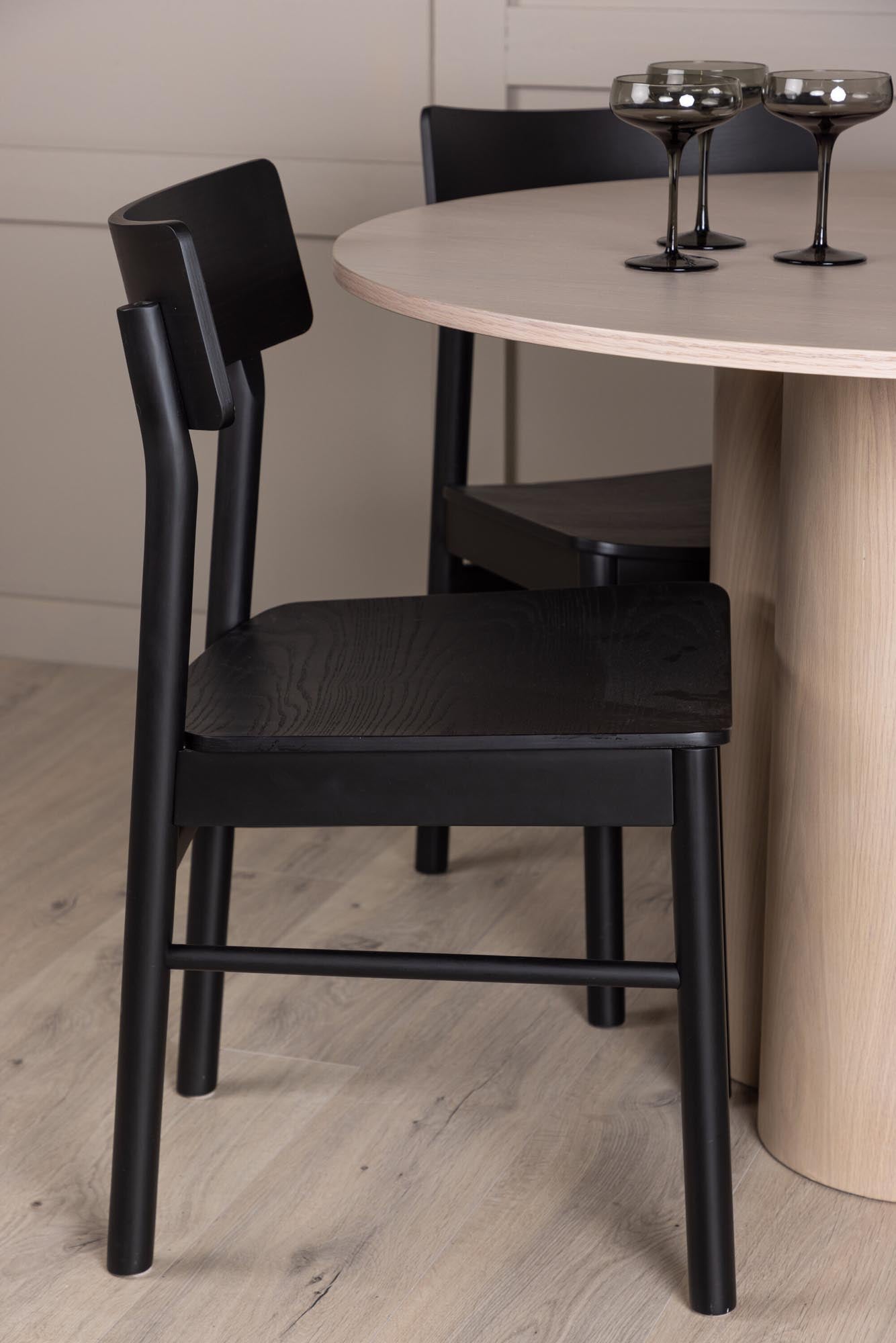 Stilvolles Olivia Esszimmer Set mit runder Tischplatte (110 cm) und 4 langlebigen Montros Stühlen. Perfekt für gemütliche Essensrunden.