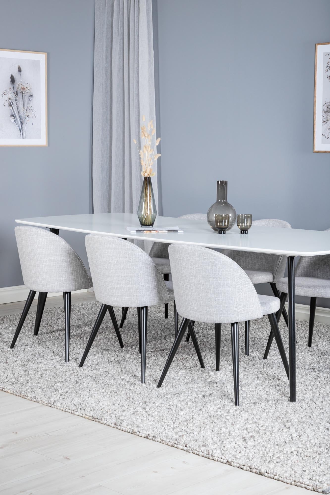 Modernes Esszimmer Set Polar mit stilvollen Velvet-Stühlen.