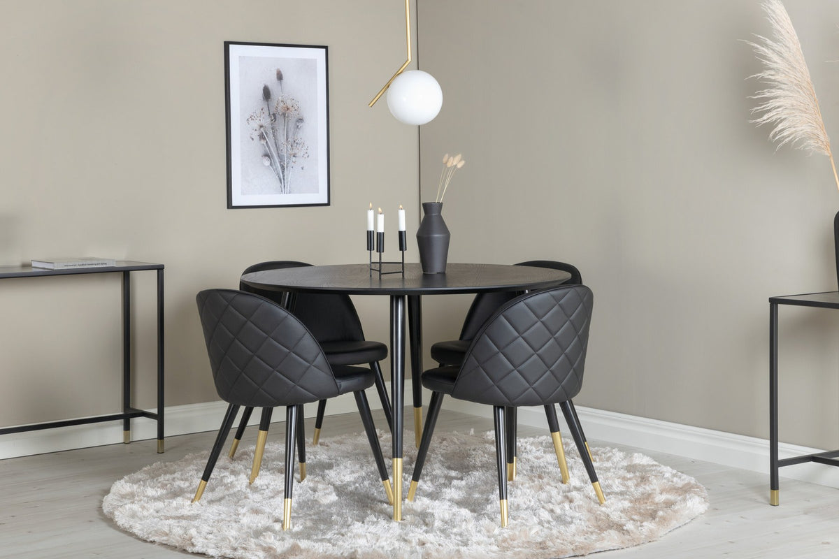 Rundes Dipp Esszimmerset: Esstisch ⌀115 cm mit schwarzem Furnier und schwarzen Beinen, dazu vier Velvet-Stühle mit schwarz-grauem Mikrofaserbezug.