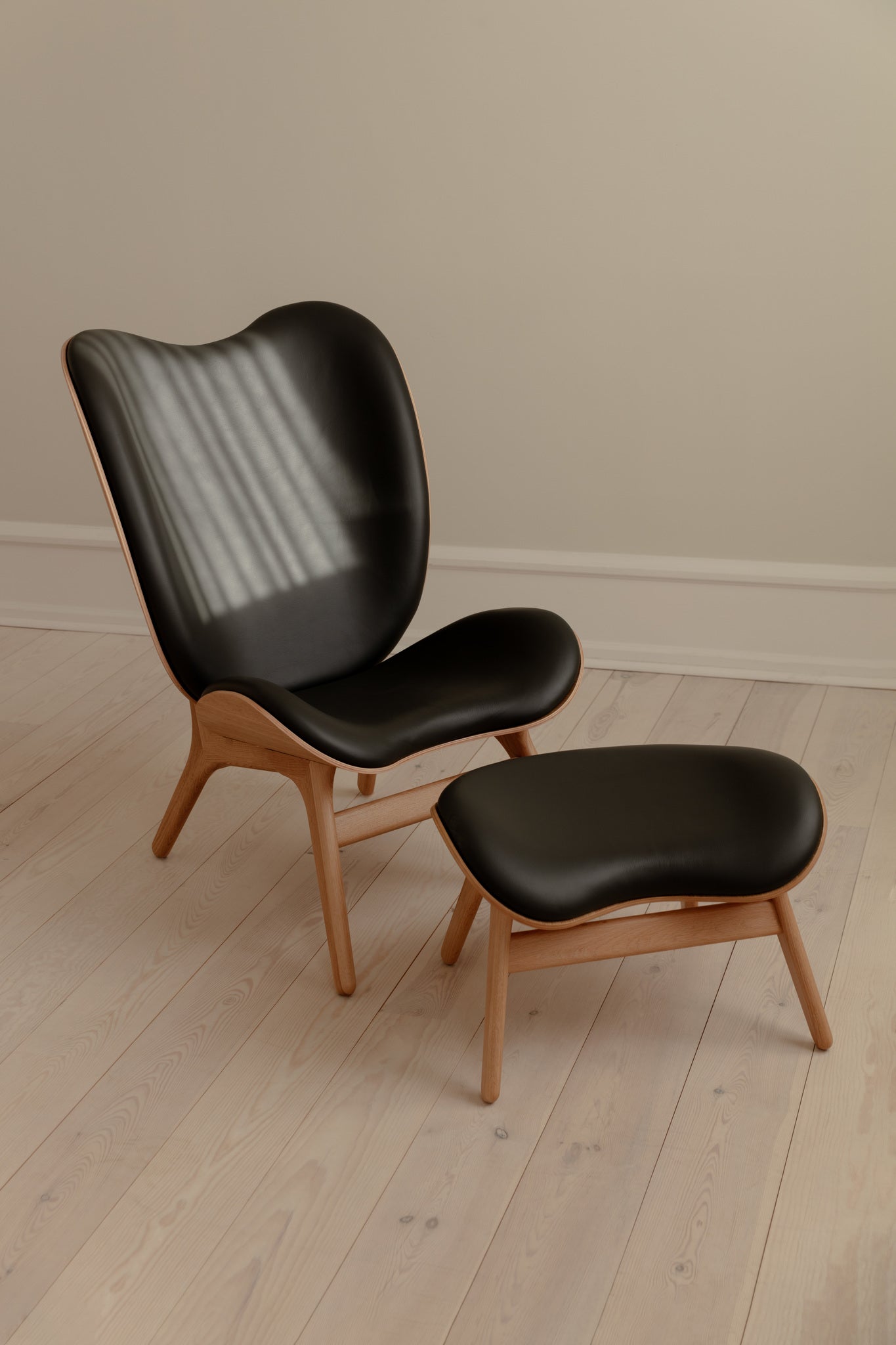 A conversation piece tall armchair