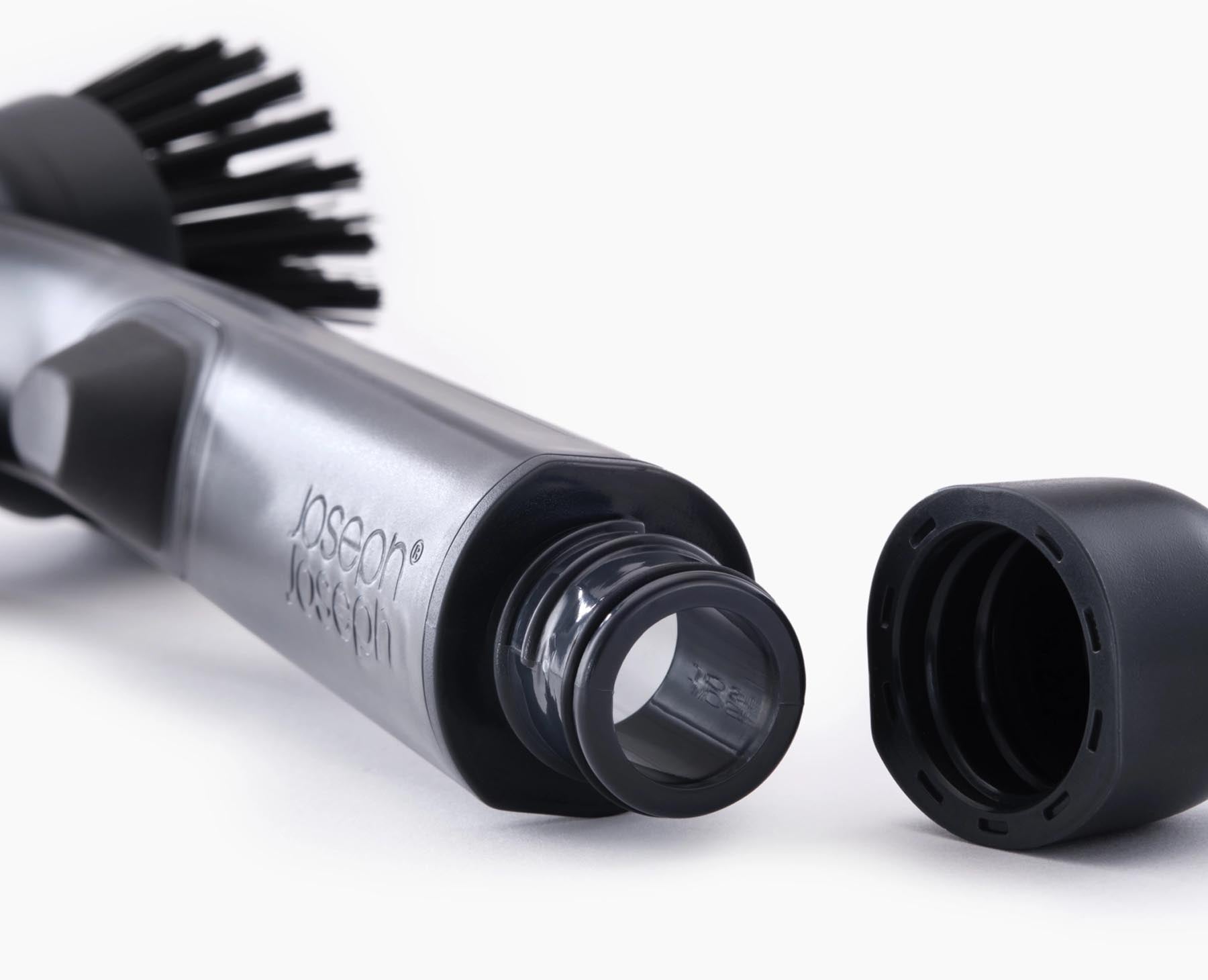 Moderne Spülbürste von Joseph Joseph mit Seifenspender und Ersatzkopf, perfekt für müheloses und hygienisches Geschirrspülen.