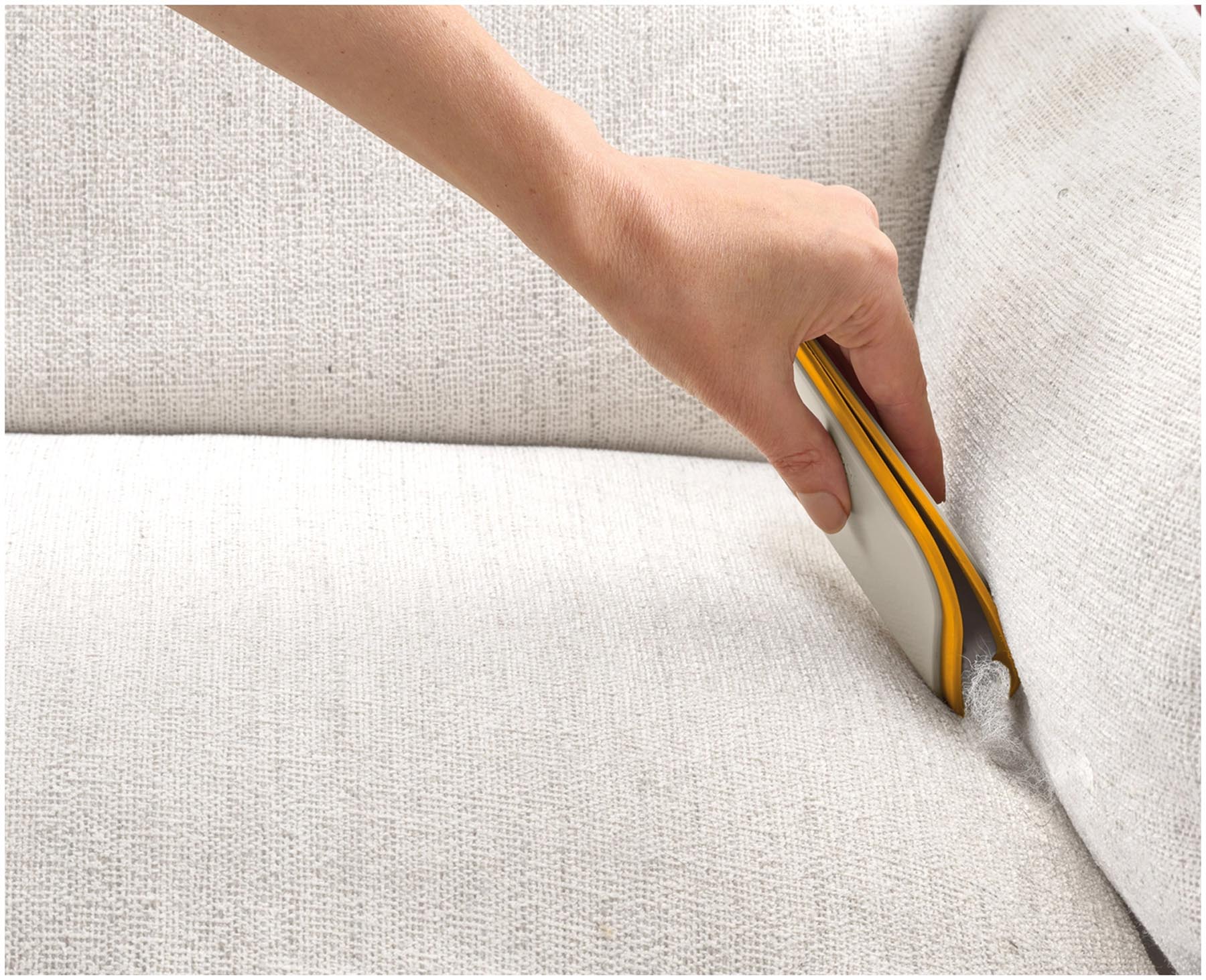 Hellgraues CleanTech 3-in-1 Gadget von Joseph Joseph zur effektiven Entfernung von Tierhaaren, ideal für eine saubere Umgebung.