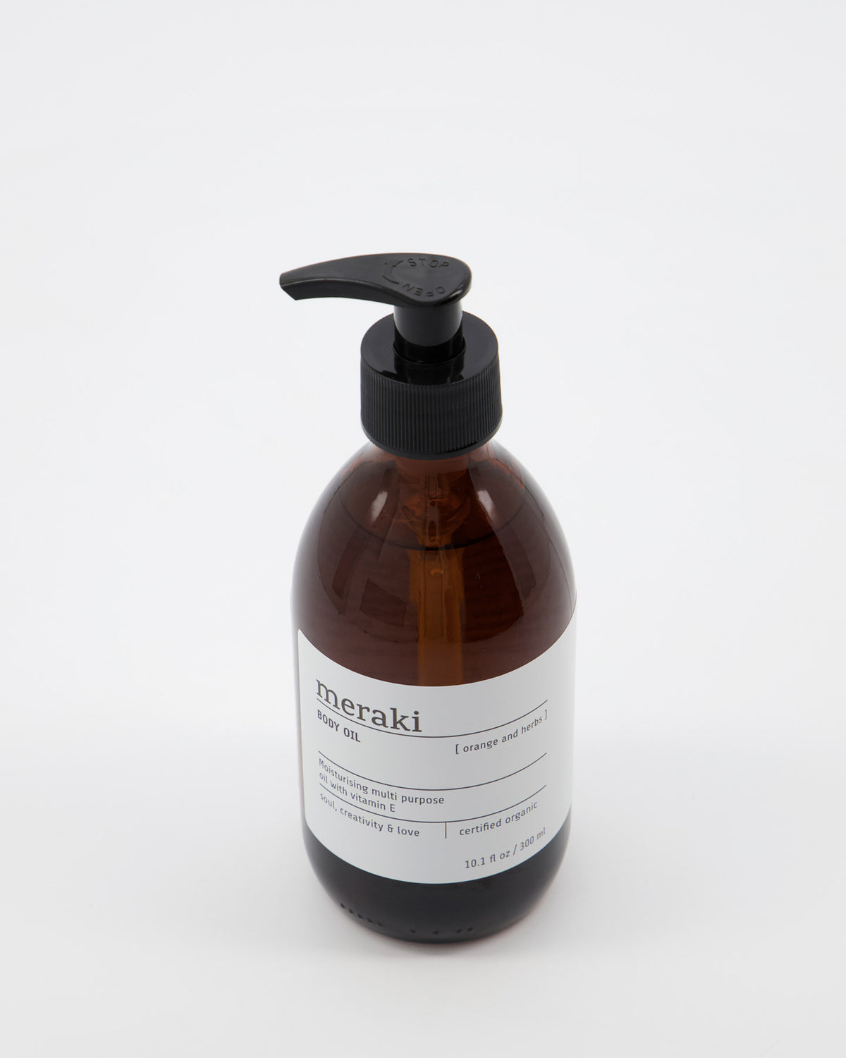 Meraki Body oil Orange & herbs, Körperpflegeöl in braunem, zylindrischem Behälter