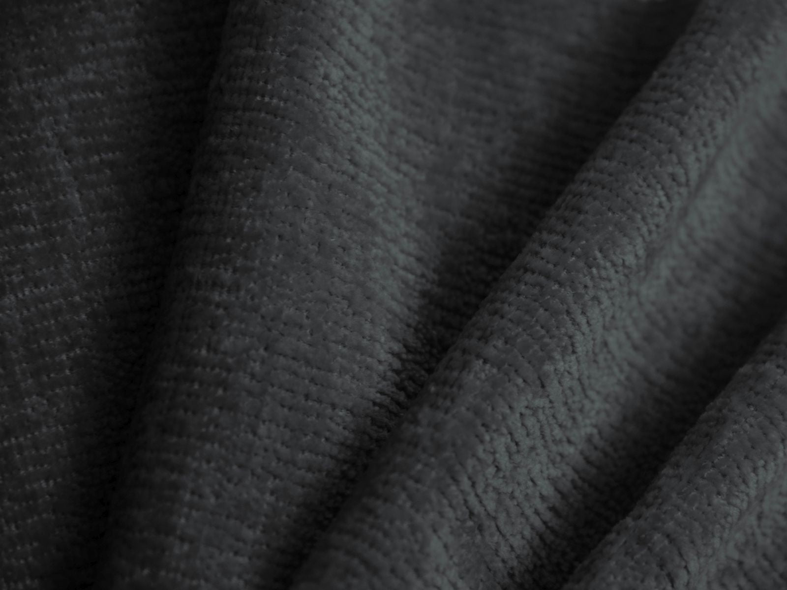 Modernes Ovalo Bett mit großzügigem Stauraum und geschmackvollem Kopfteil in Dunkelgrau, perfekt für stilvolle Schlafzimmergestaltung.
