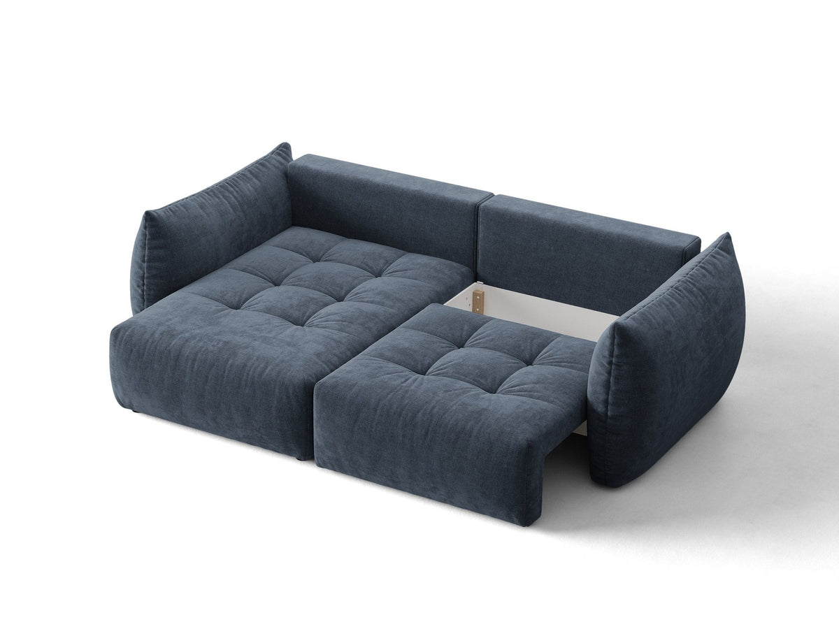 Ecksofa Bloom in Sand mit Velours-Bezug, schwarzen Kunststoffbeinen und ausklappbarer Schlaffunktion samt Bettkasten unter der Sitzfläche.