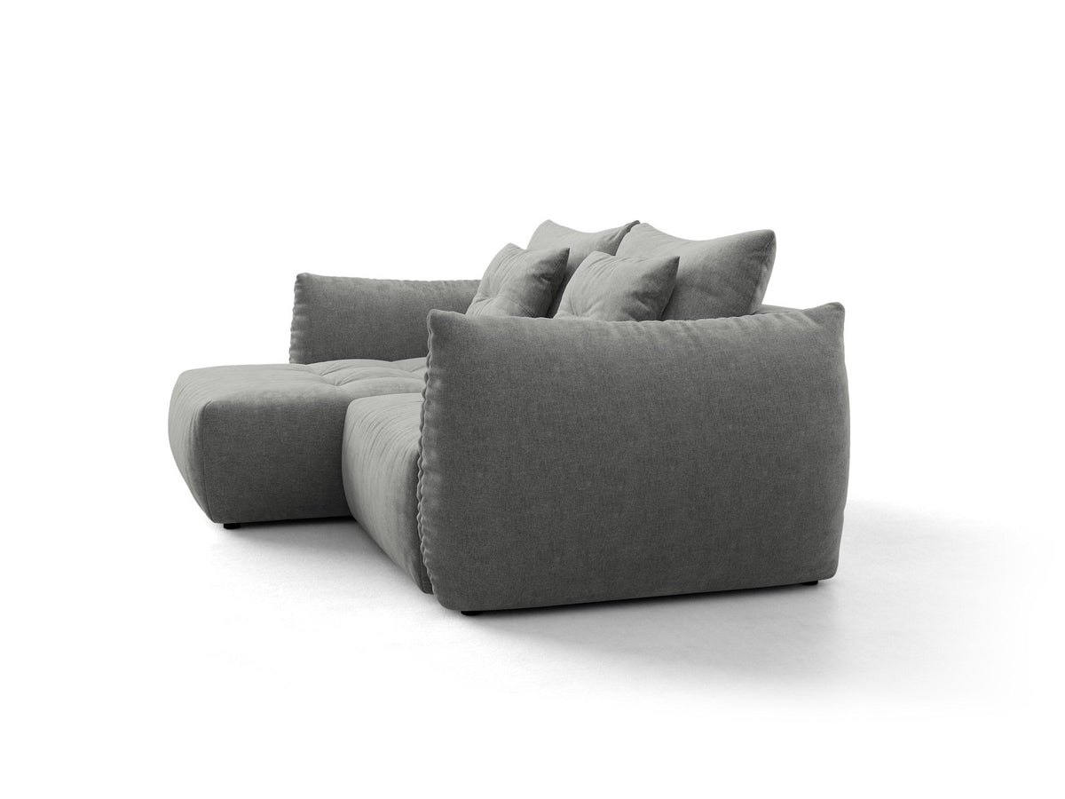 Ecksofa Bloom in Sand mit Velours-Bezug, schwarzen Kunststoffbeinen und ausklappbarer Schlaffunktion samt Bettkasten unter der Sitzfläche.