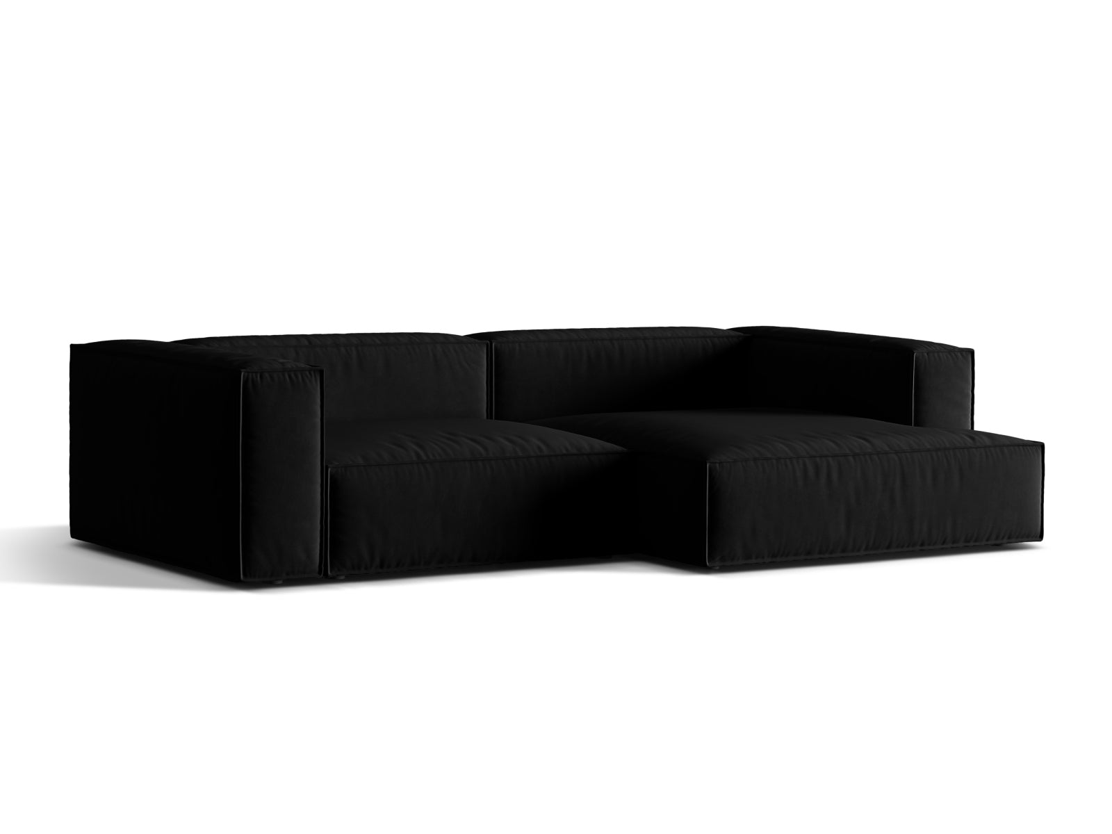Elegantes Nuria Velour Ecksofa in Schwarz, modular und komfortabel, ideal für stilvolle Wohnräume. Perfekt für entspannte Abende.