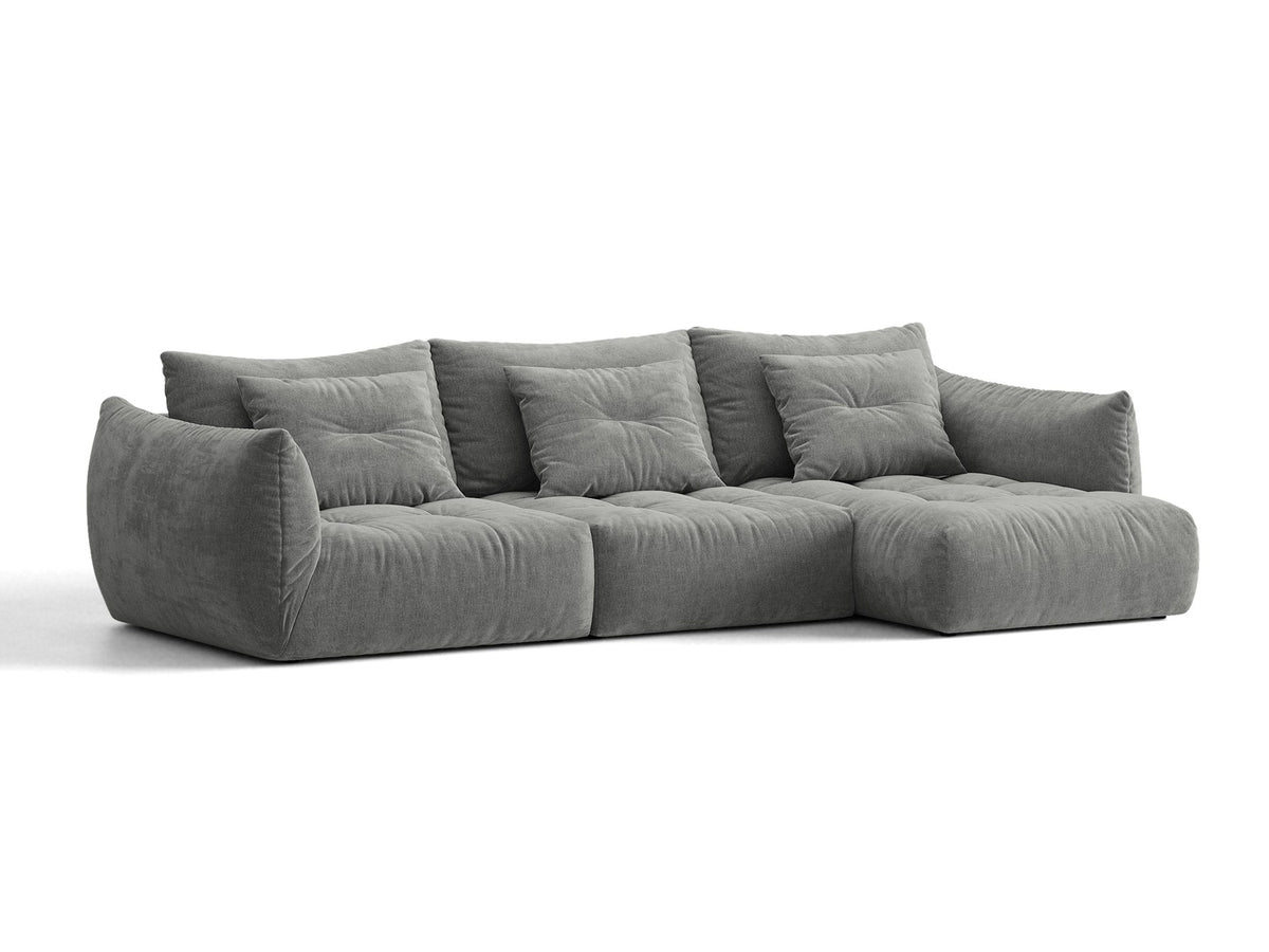 Beiges L-Sofa rechts Bloom von Micadoni mit Veloursstoff-Bezug Casino Pearl, schwarzen Kunststoffbeinen und sichtbarem Staufach unter der Sitzfläche.