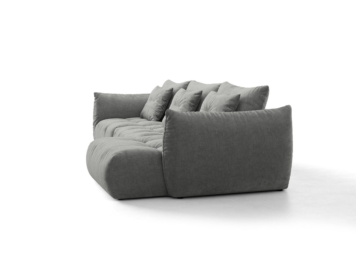 Beiges L-Sofa rechts Bloom von Micadoni mit Veloursstoff-Bezug Casino Pearl, schwarzen Kunststoffbeinen und sichtbarem Staufach unter der Sitzfläche.