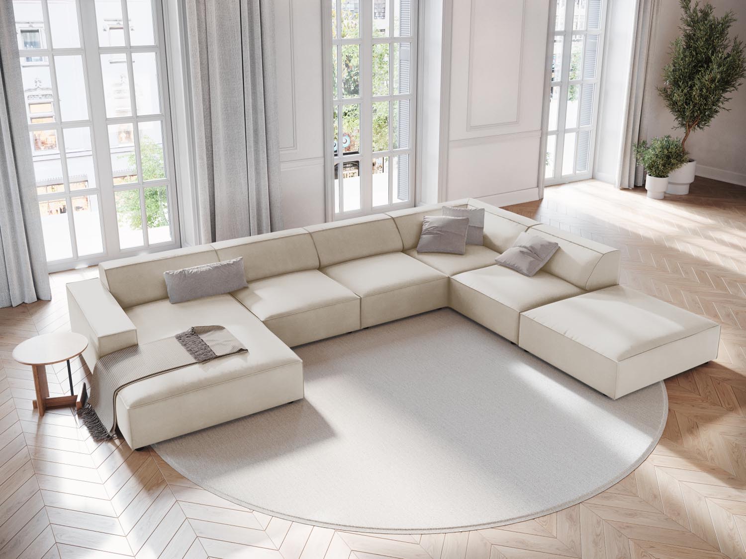 Elegantes, modulares 7-Sitzer Ecksofa Jodie in dunkelbeigem Velours, ideal für stilvolle Wohnräume, präsentiert in einem modernen Ambiente.