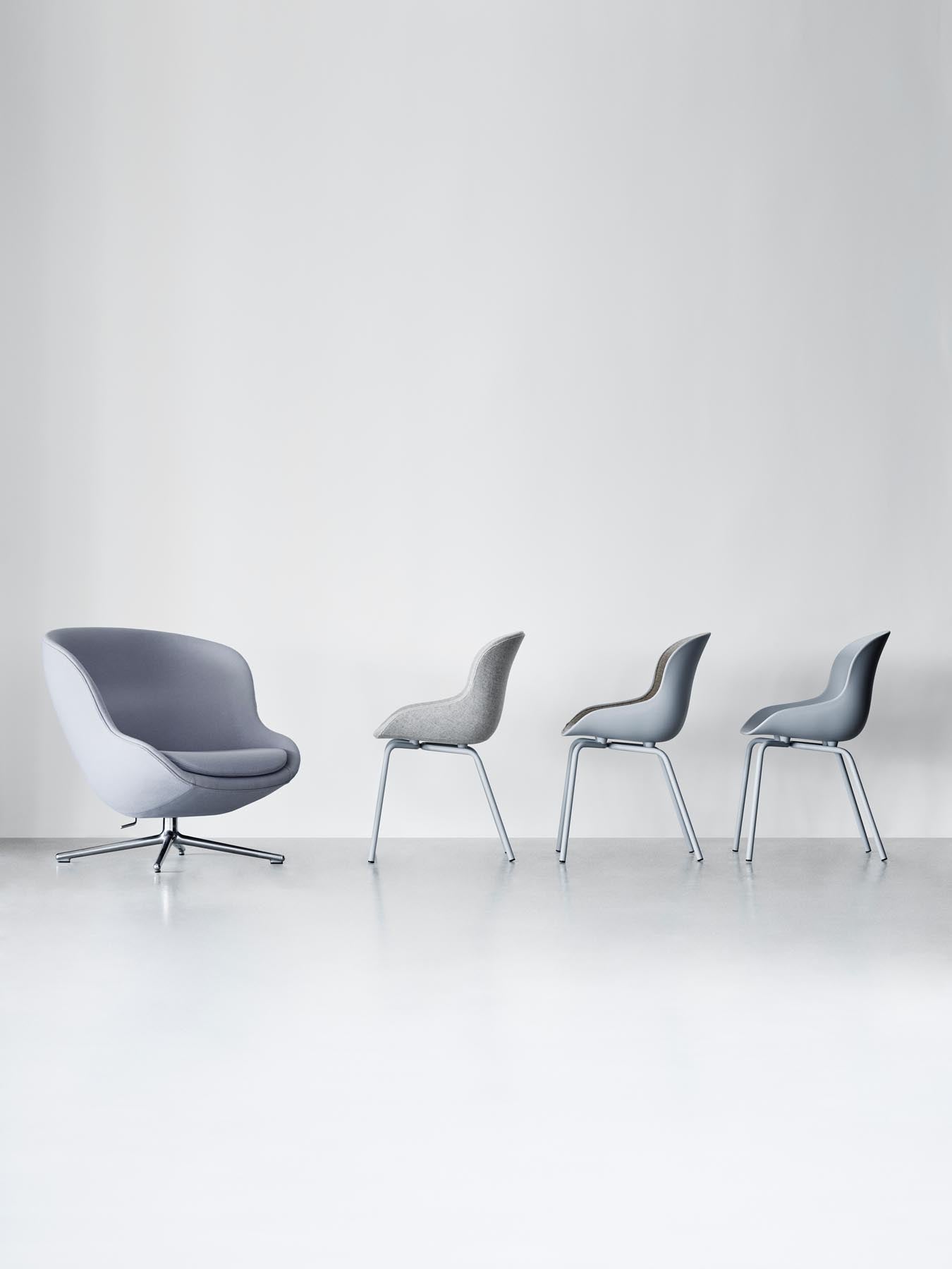 Der Hyg Stuhl von Normann Copenhagen: Sanfte Linien, umhüllende Konturen, inspiriert von dänischer Hygge für Gemütlichkeit und Wärme.