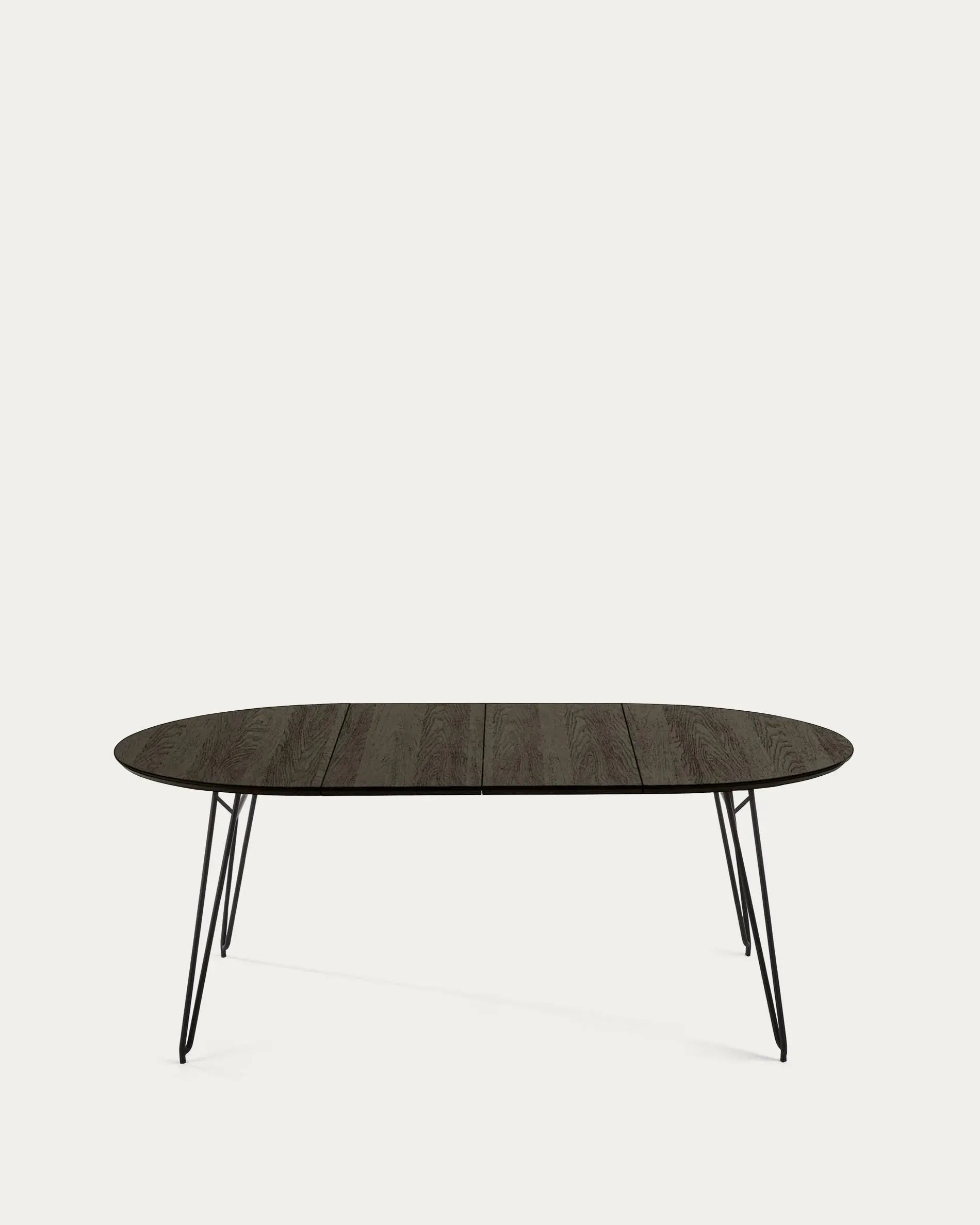 Eleganter runder Esstisch mit ausziehbarer Funktion, Eschenfurnier und schwarzen Stahlbeinen, perfekt für moderne Esszimmer.