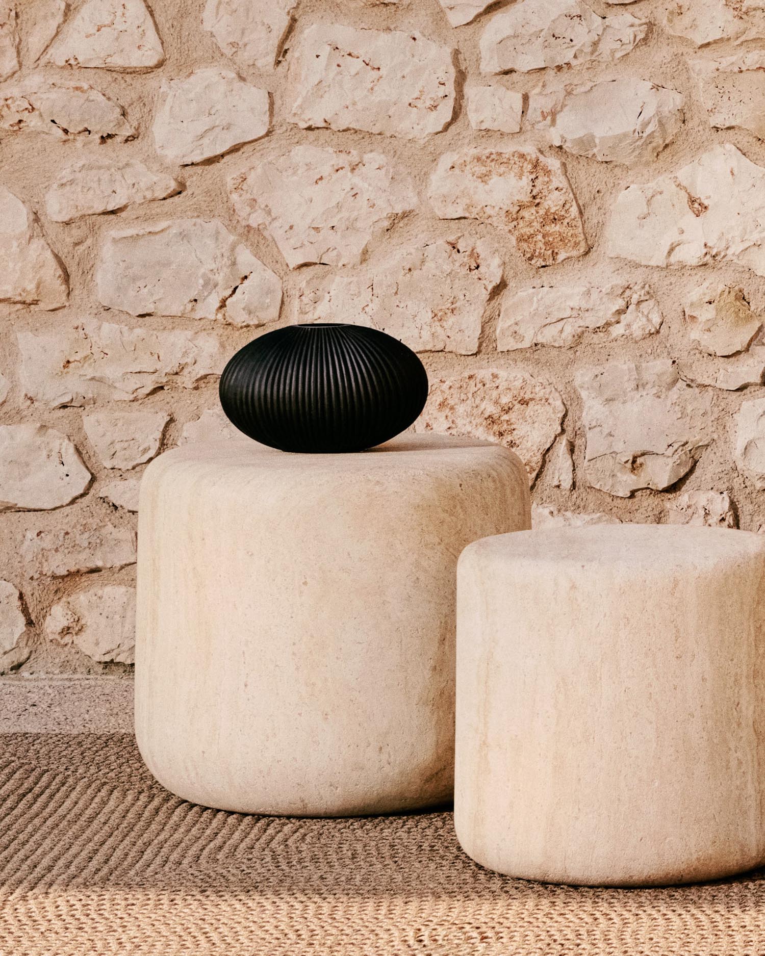 Drasi side table made of cement with a travertine-look finish Ø 60 cm