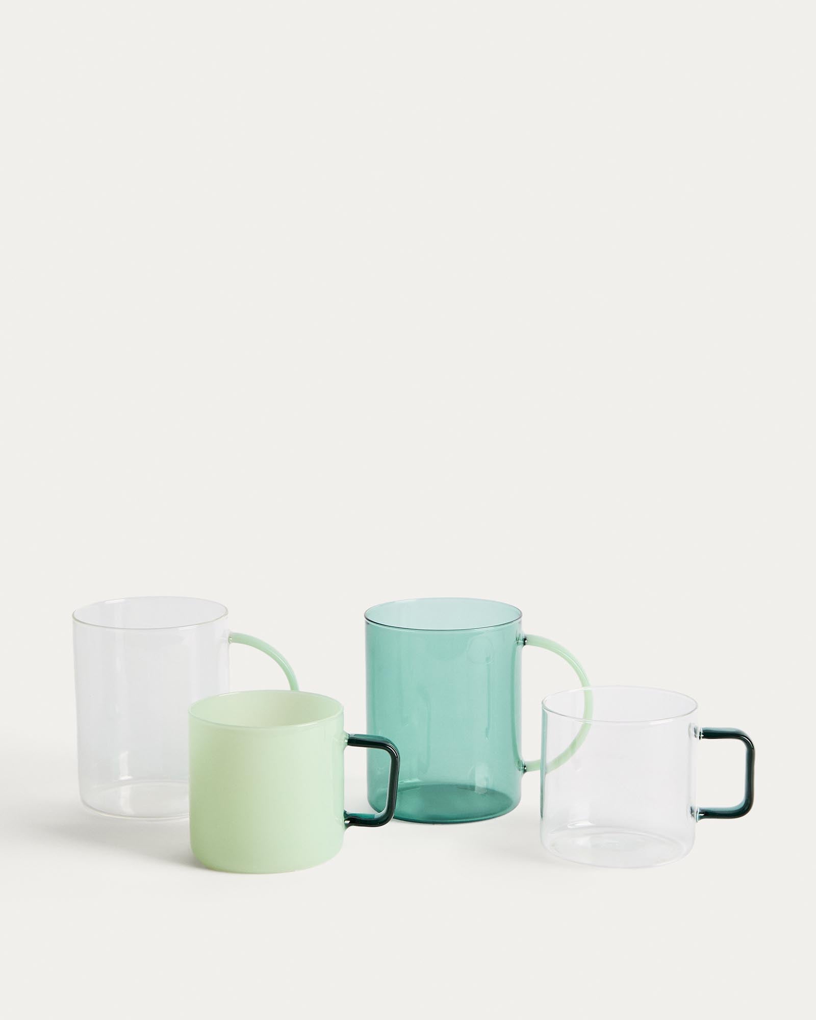 Moderne Glastasse Micla mit auffälligem grünem Henkel, ideal für den täglichen Gebrauch und stilvolle Kaffeepausen.
