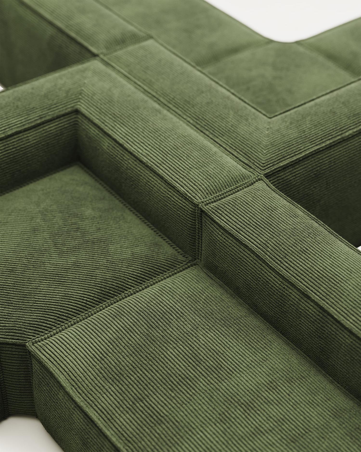 Das Blok Ecksofa in grünem Cord bietet Platz für 6 Personen, misst 320x320 cm und ist nachhaltig mit FSC-Zertifikat.