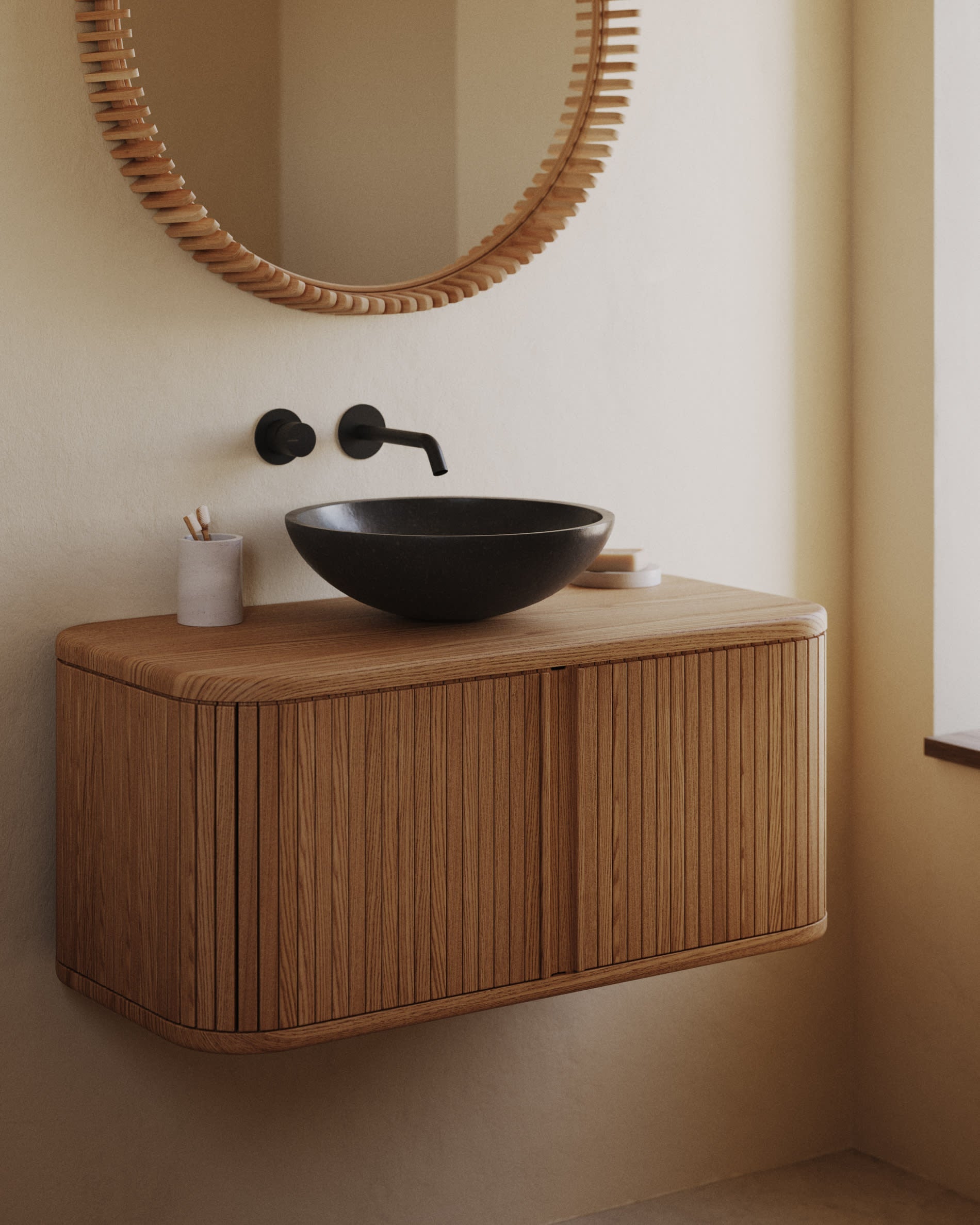 Moderner schwarzer Terrazzo-Aufsatzwaschtisch Delina von Kave Home, Ø 40 cm, ideal für stilvolle Badezimmer.