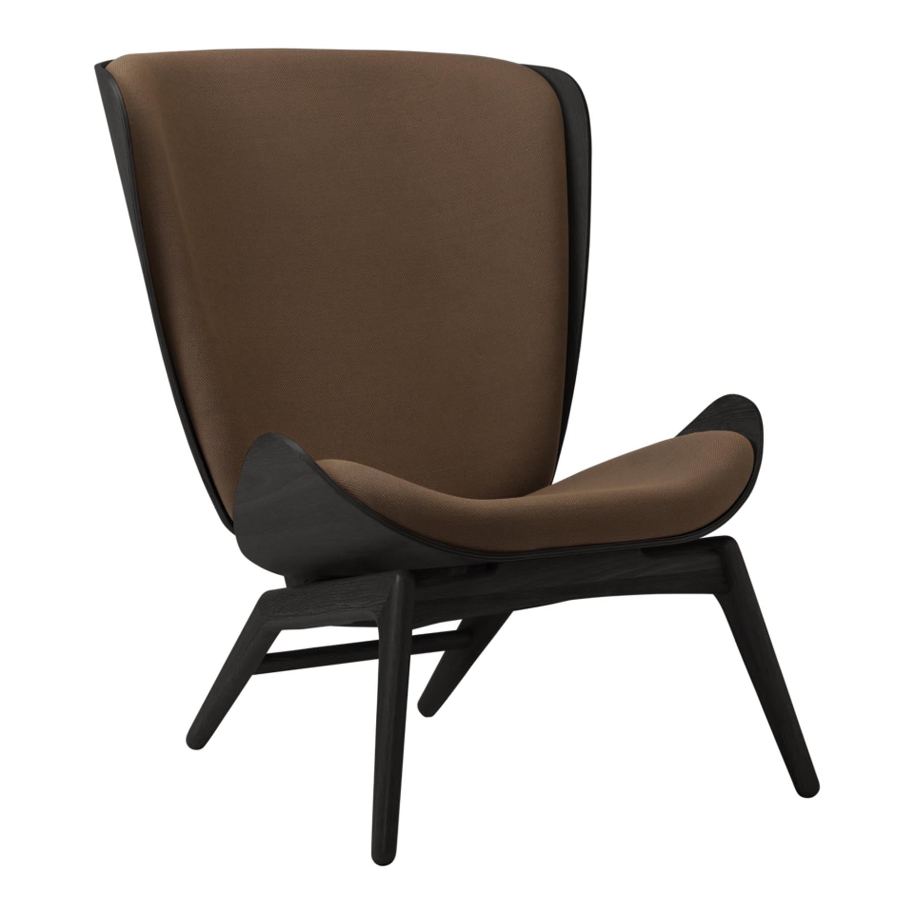 Eleganter Reader Sessel von Umage, ideal für gemütliche Leseecken. Hochwertige Materialien und ansprechende Form sorgen für Komfort und Stil.