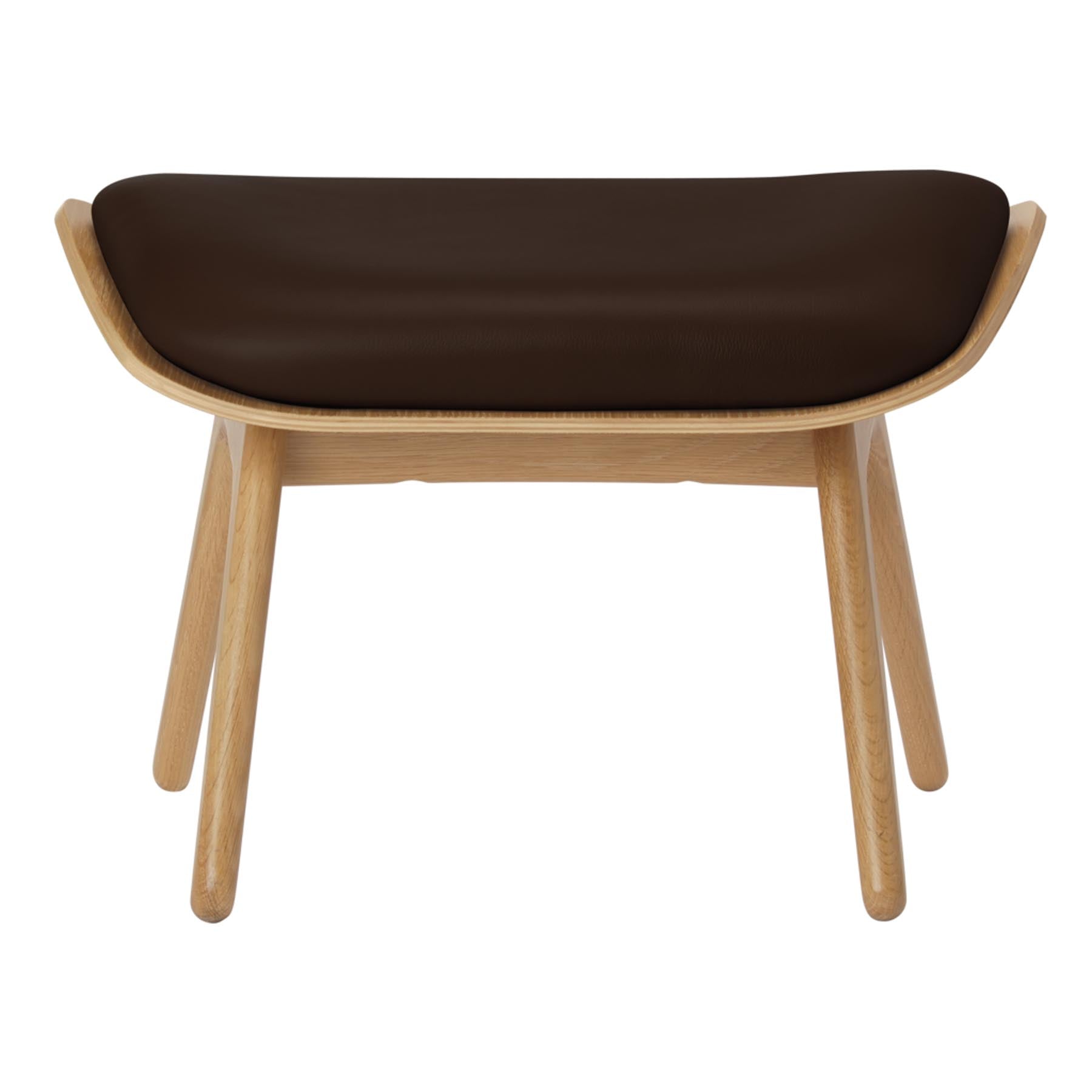 Eleganter brauner Ottoman "The Reader" von Umage, ideal für stilvolle Wohnräume und gemütliche Leseecken.