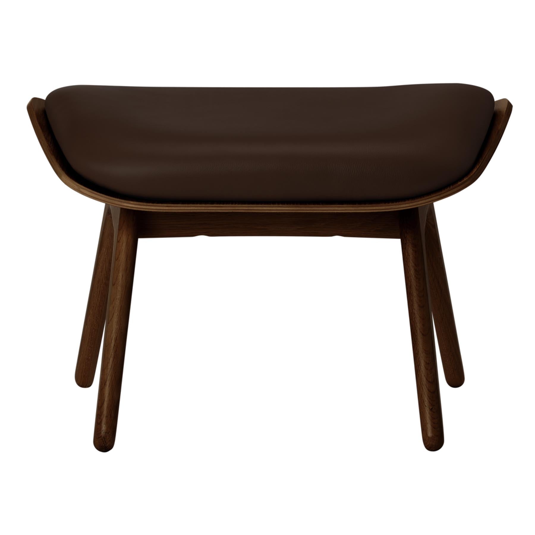 Eleganter Ottoman "The Reader" von Umage in einem warmen Braunton, ideal für gemütliche Leseecken und stilvolle Inneneinrichtungen.