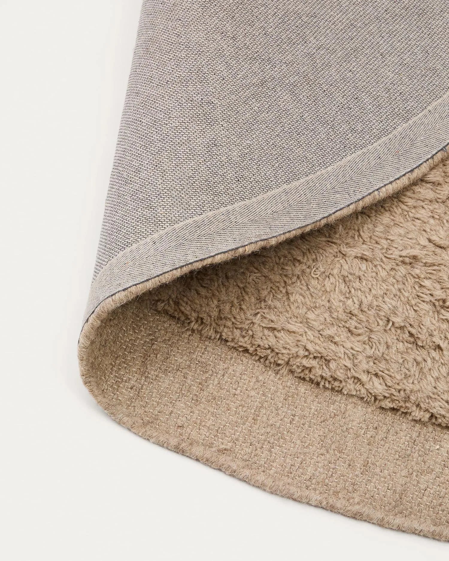 Eleganter, runder Wollteppich in Beige, Ø 200 cm, handgefertigt, langlebig und umweltfreundlich.
