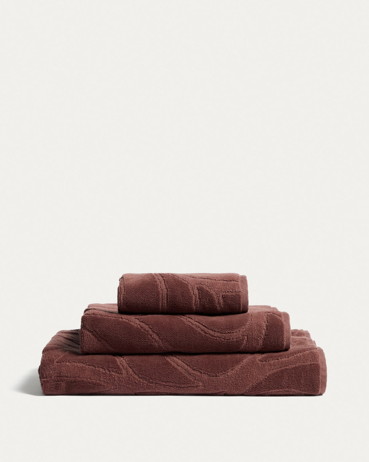 Weinrotes Toilettenhandtuch aus 100% Baumwolle mit Jacquard-Muster und samtiger Oberfläche, Format 30 x 50 cm.